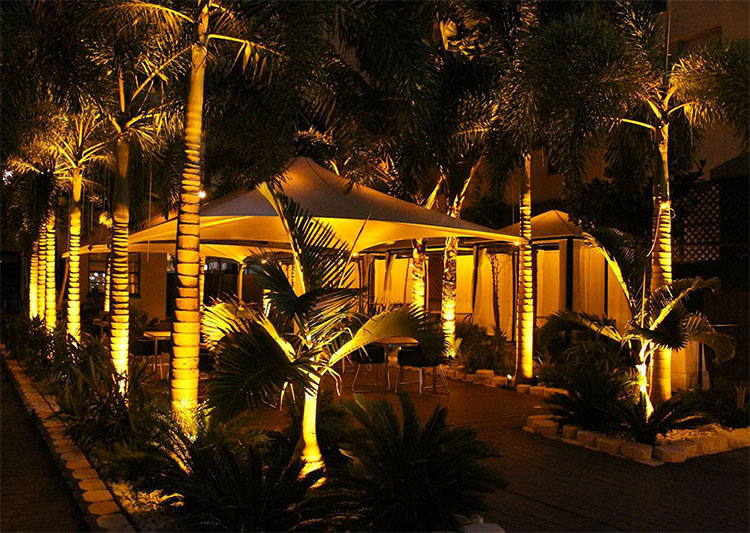 Yellow LED mood lighting for outdoor dinning at a restaurant in Miami, FL