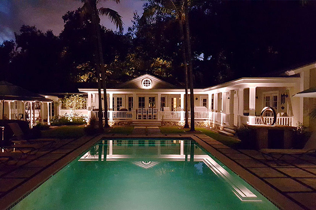 Residential pool lighting in the backyard with outdoor lights.